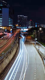 Light trails on road in city at night