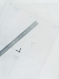 Close-up of blueprint and ruler