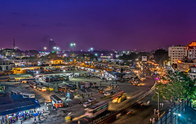 High angle view of illuminated city street against sky