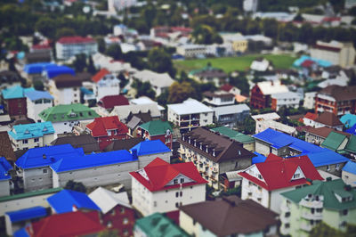 Tilt-shift image of houses in city