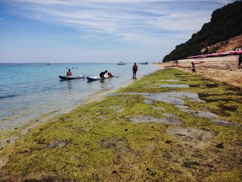 People enjoying at beach