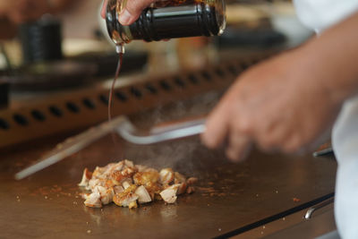 Close-up of person preparing food