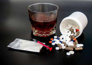 Close-up of drink on table against white background