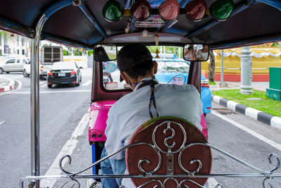 Rear view of woman in car