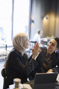 Businesswomen talking in cafe