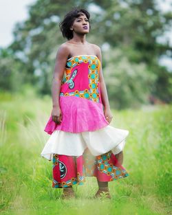 Young woman standing on field