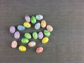 High angle view of multi colored eggs on table