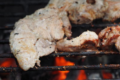 Close-up of meat on barbecue grill