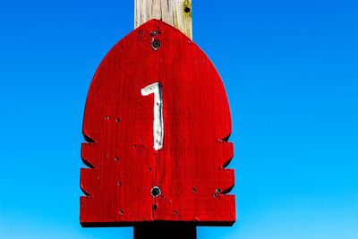 Low angle view of tree against clear blue sky
