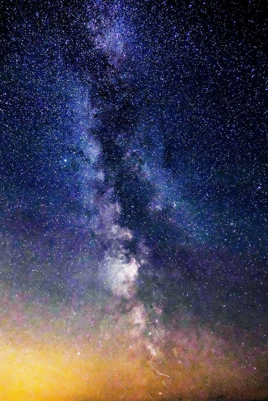 LOW ANGLE VIEW OF STAR FIELD AGAINST SKY