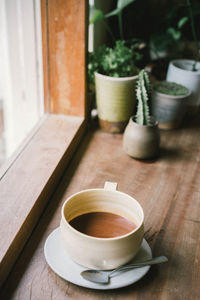 Close-up of coffee cup on table