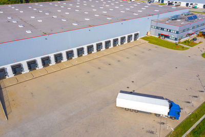 Aerial view of warehouse with trucks. industrial background. logistics from above.