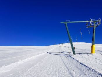 Skiing lift on corno del renon against mountain and clear blue sky in the southtyrolean alps