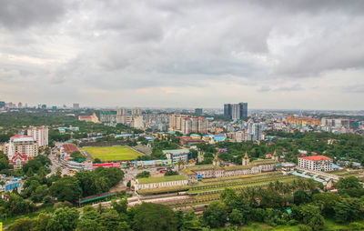 High angle view of buildings in city against sky