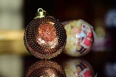 Close-up of christmas baubles on table