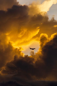 Low angle view of dramatic sky during sunset