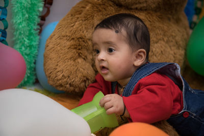 Portrait of cute boy with toy