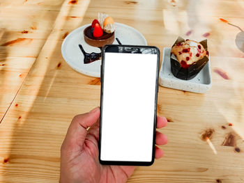 High angle view of smart phone on table