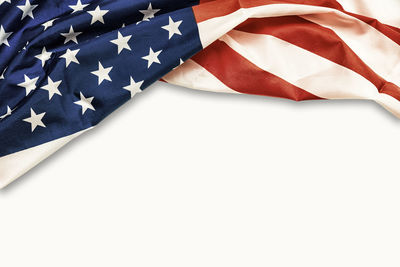 Close-up of american flag against white background