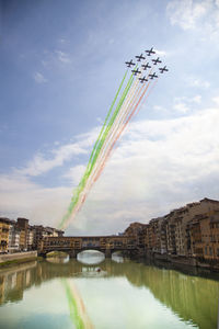 Italy, florence,  the city and freccie tricolori airplane.
