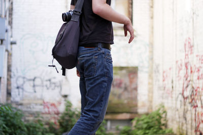 Midsection of man walking outdoors