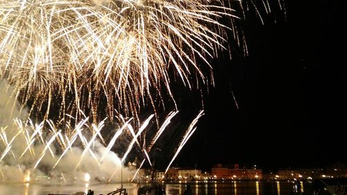 Firework display at night