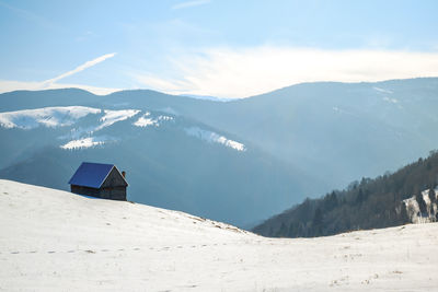 Sun over the winter mountains with snow, cindrel mountains, paltinis, romania