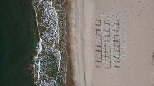 High angle view of text on beach