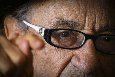 Close-up portrait of man wearing eyeglasses