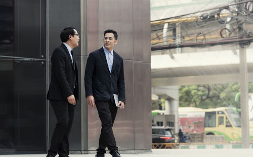 Man and woman standing in front of office