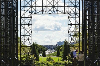 Silhouette of woman against cloudy sky