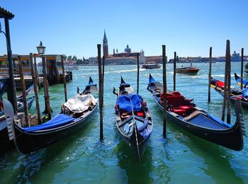 Boats moored in canal