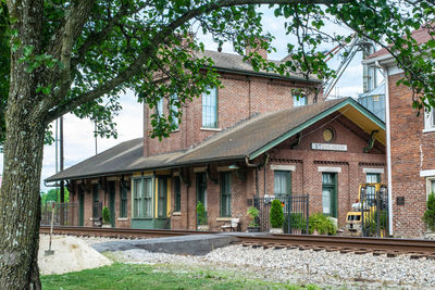 Exterior of house by building against sky