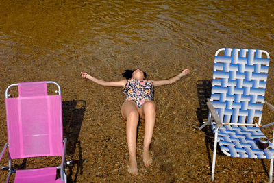 High angle view of friends enjoying in water