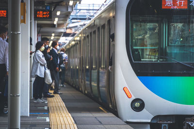 People at railroad station platform