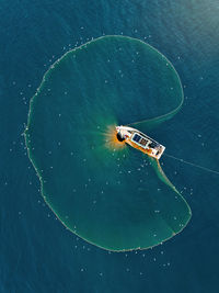 High angle view of boat floating on sea