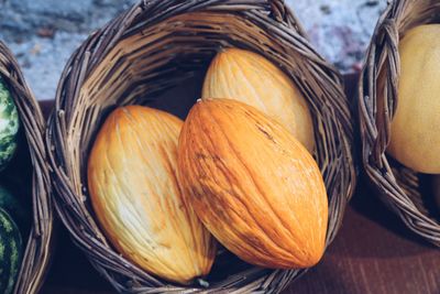 Close-up of pumpkins in basket on table