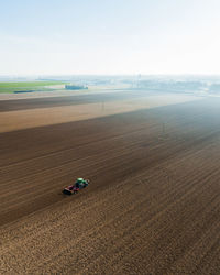 High angle view of motorcycle on field against sky
