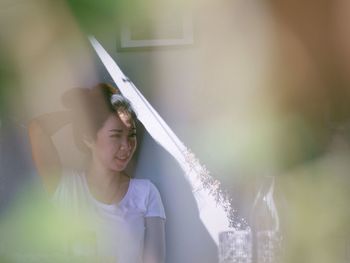 Young woman holding camera