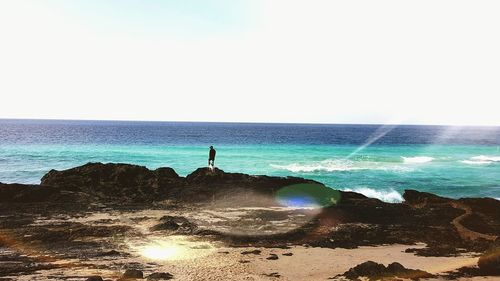 Scenic view of sea against clear sky