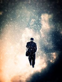Person standing in the dark