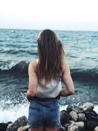 Rear view of woman looking at sea