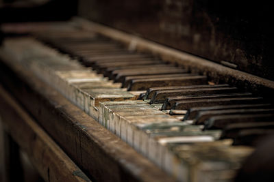 Close-up of abandoned piano
