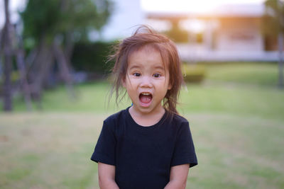 Portrait of shocked girl in playground