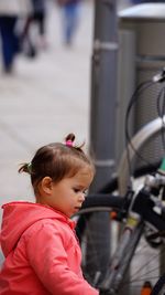 Side view of girl looking away on footpath