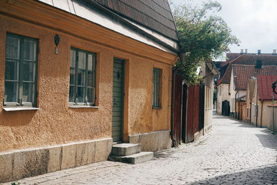 Houses by street in city