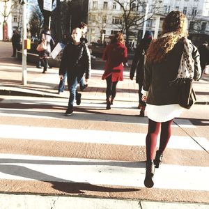 Full length of woman standing on city street