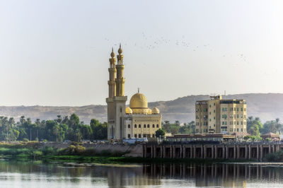 Egypt, aswan governorate, aswan, bank of nile with el-tabia mosque in background