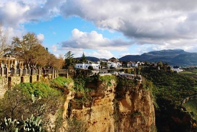 View of town against cloudy sky