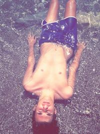 Low section of woman standing on wet floor